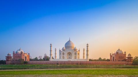 Travel: Panorama of the iconic Taj Mahal from the north across the Yamuna river at sunset, India.